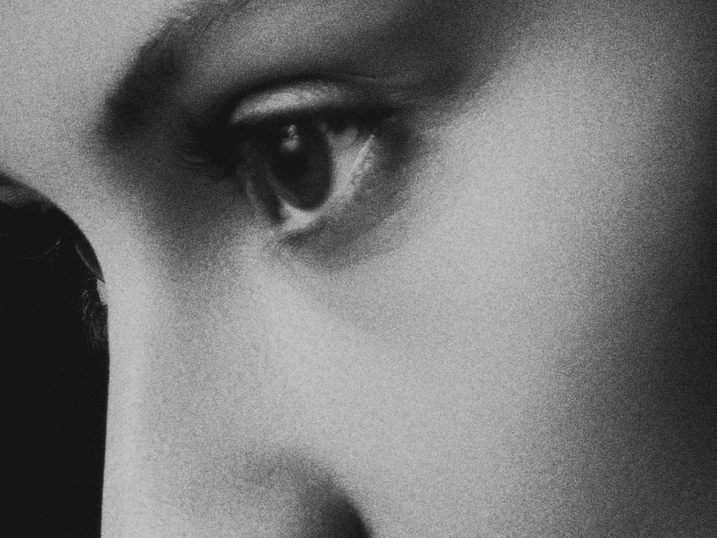 Eye and nose, close-up, of a woman, intrusive thoughts.