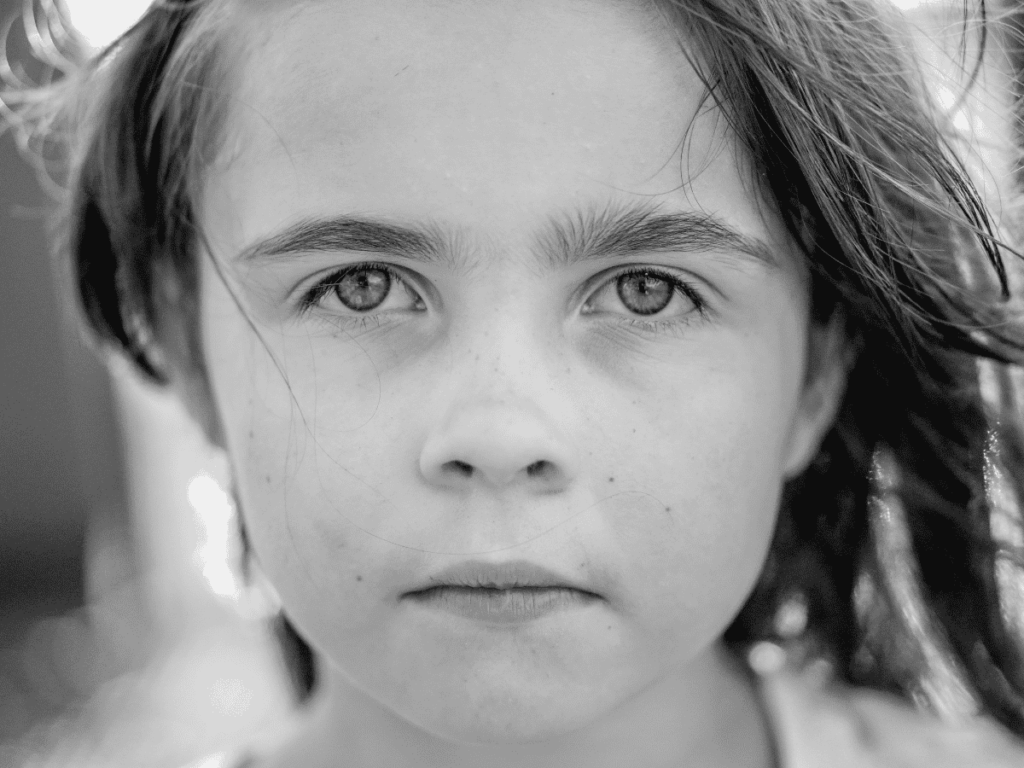 Portrait photo, black and white, 5 year old girl. neglected child